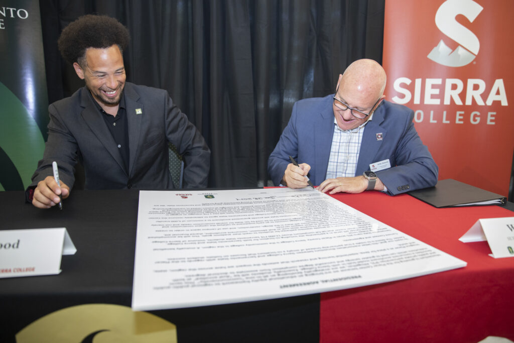 Sacramento State Pres. Luke Wood and Sierra College Supt. and Pres. Willy Duncan sign partnership agreement for Sacramento State Placer